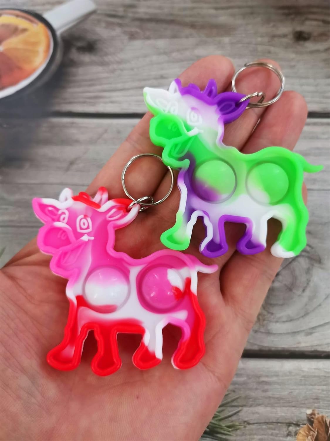 100-Pack Mini Pop Cow Fidget Keychain Backpack